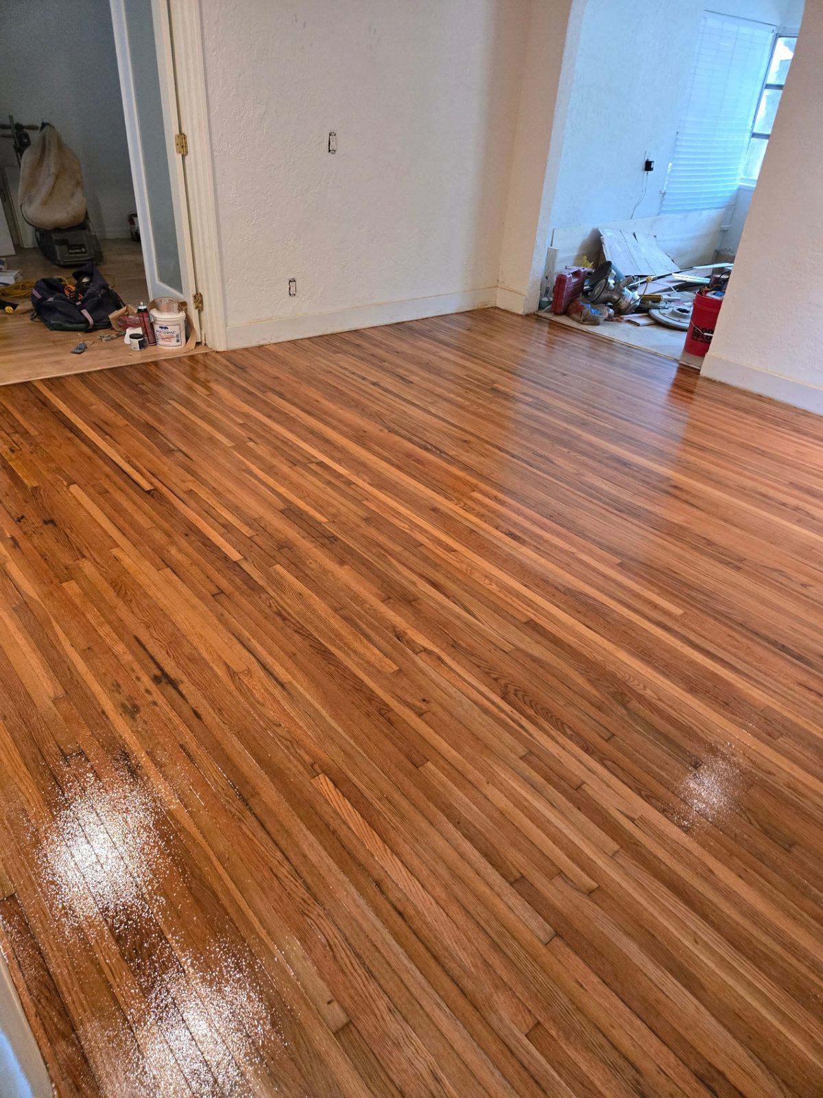 Finished refinished hardwood flooring spanning multiple rooms of a Hollywood, FL home